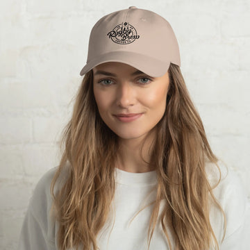 Woman wearing a Rugby Brew Coffee Co. dad hat in stone