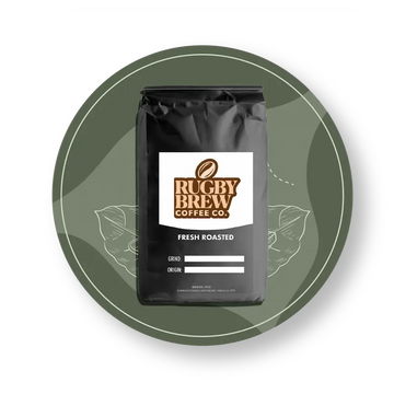 A black bag of Rugby Brew Coffee Co. Fresh Roasted coffee, centered on a dark olive green circular graphic background with white leaf line art.